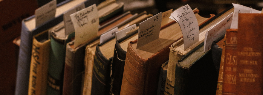 Old books with cards sticking out